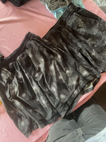 Two pairs men’s patterned gray shorts