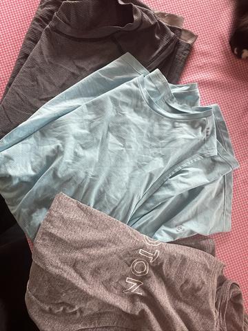 Three men’s athletic tank tops