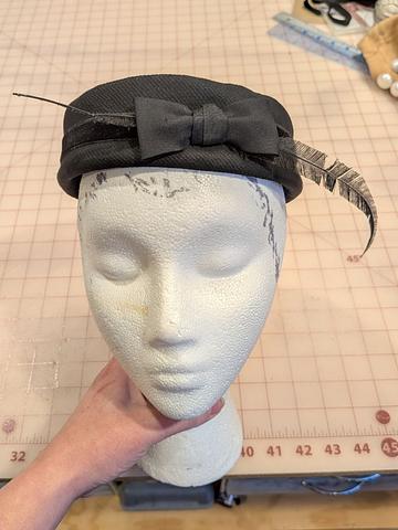 1950s black pill box hat with bow and feather