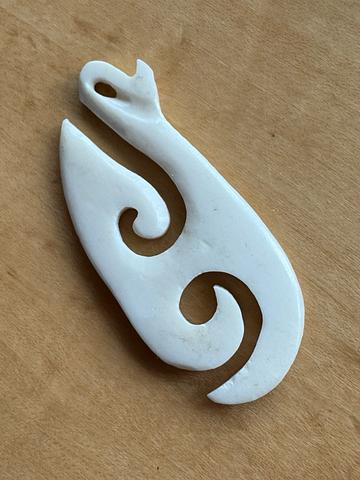 Carved bone pendant