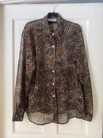 Pearl-buttoned leopard print top