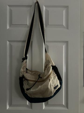 Patagonia Packable crossbody bag in cream, teal and black