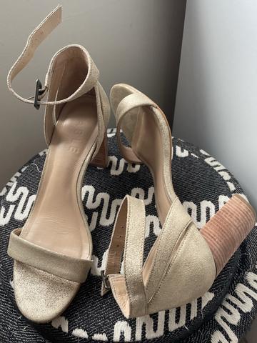Golden strappy high heeled sandal
