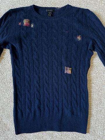 Cashmere sweater with mends