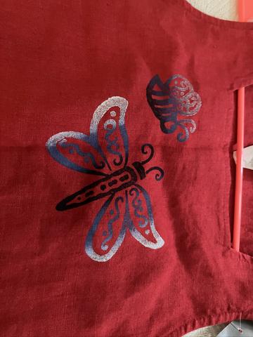 Red dress with butterfly and bee