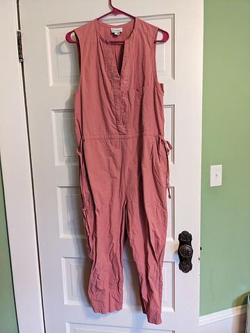 Pink jumpsuit with buttons and side ties