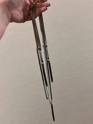 Metal necklace with tassels