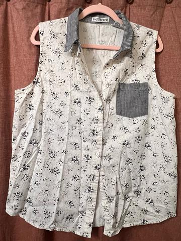 Sleeveless button down top