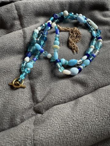 Blue bead and tassel necklace
