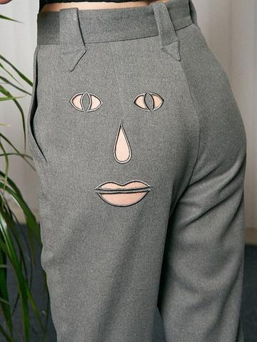 Face cut out pants