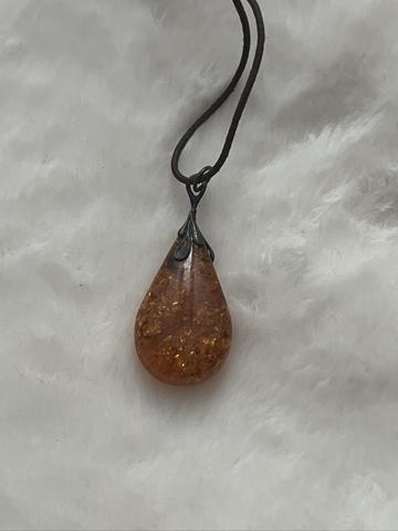 Amber teardrop on leather cord necklace with sterling hardware