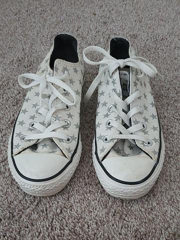 White with silver stars Chuck Taylor low top sneakers