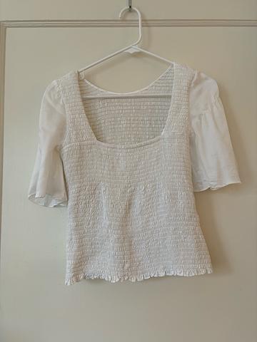 The Smocked Flutter Sleeve Blouse