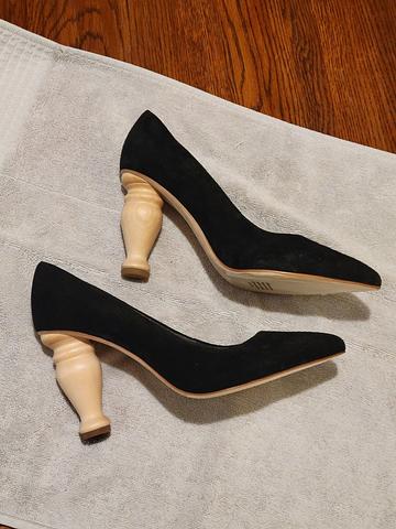Black suede pumps with furniture leg heel