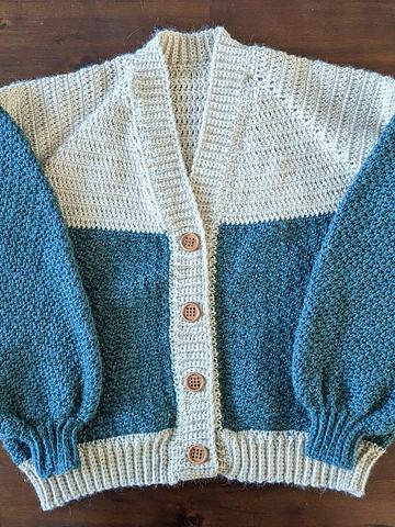 Crocheted green and white cardigan