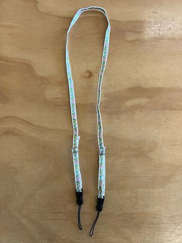 white floral camera strap