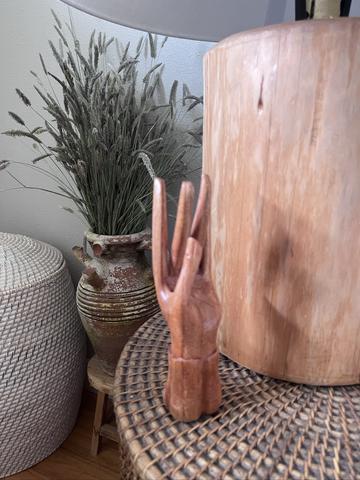 carved wooden hand